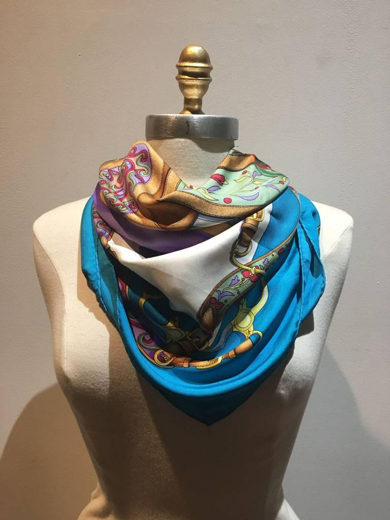 Beautiful Vintage Hermes festivals silk scarf in excellent condition.  Original silk screen design c1992 by Henri d'Origny features an array of various colorful horse saddles and rope dressings for special festival occasions.  100% silk, hand rolled