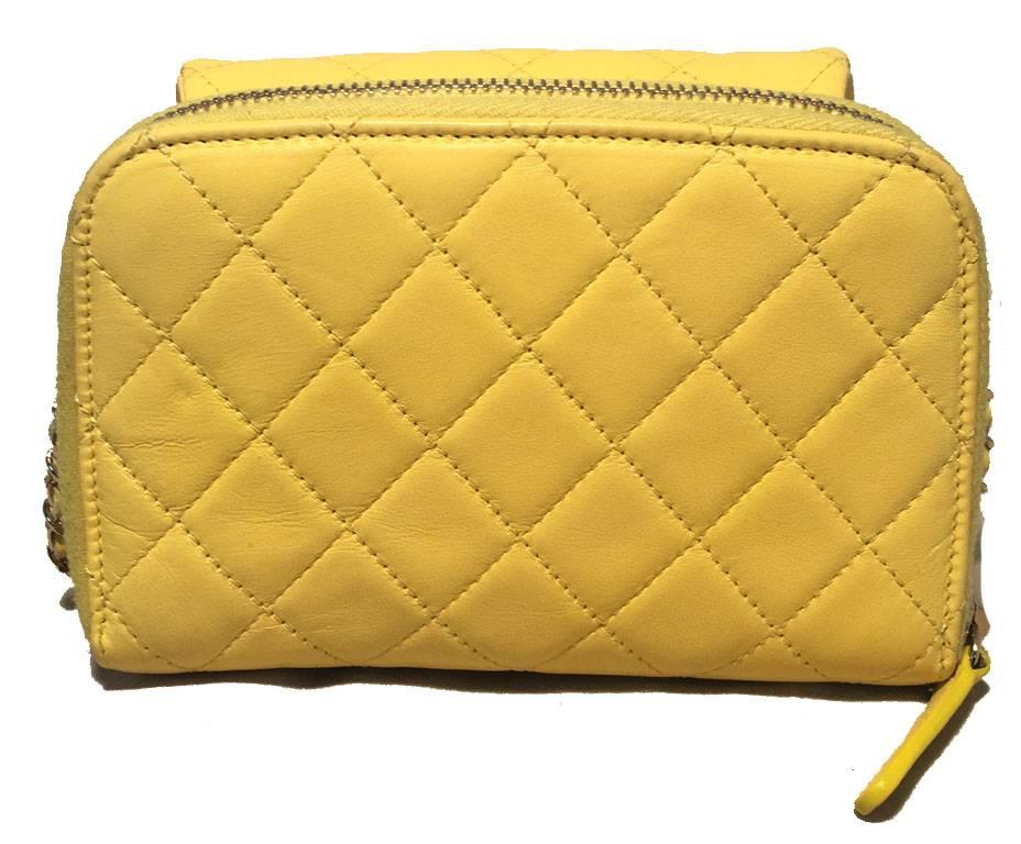 GORGEOUS CHANEL yellow leather two way wallet on a chain in excellent condition.  Quilted yellow lambskin leather exterior trimmed with gold hardware and signature woven chain and leather shoulder strap.  Two separate storage compartments.  Front