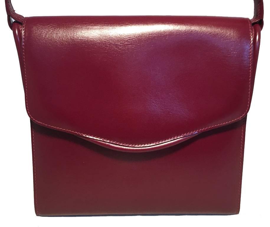 GORGEOUS HERMES vintage shoulder bag in excellent condition.  Dark red box calf leather with single flap snap style closure.  Matching dark red leather interior with a circled R stamp revealing a 1988 production date.  No stains, smells or major