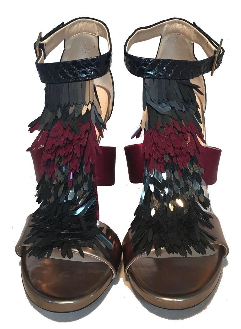 Beautiful Jimmy Choo fringe trim high heels in excellent condition.  Black snakeskin, purple satin, and gunmetal leather strap style body and heel with a matching black, gunmetal, and purple fringe tassel detail along the front side.  Angle strap