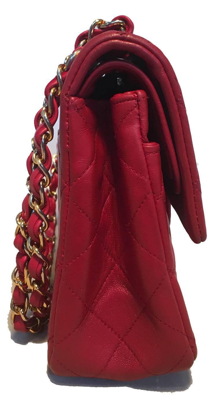 Vintage chanel 2.55 red leather double flap classic in very good condition.  Red leather quilted exterior trimmed with gold hardware.  signature woven chain and leather shoulder strap and CC logo twist closure. Double flap style closure opens to red