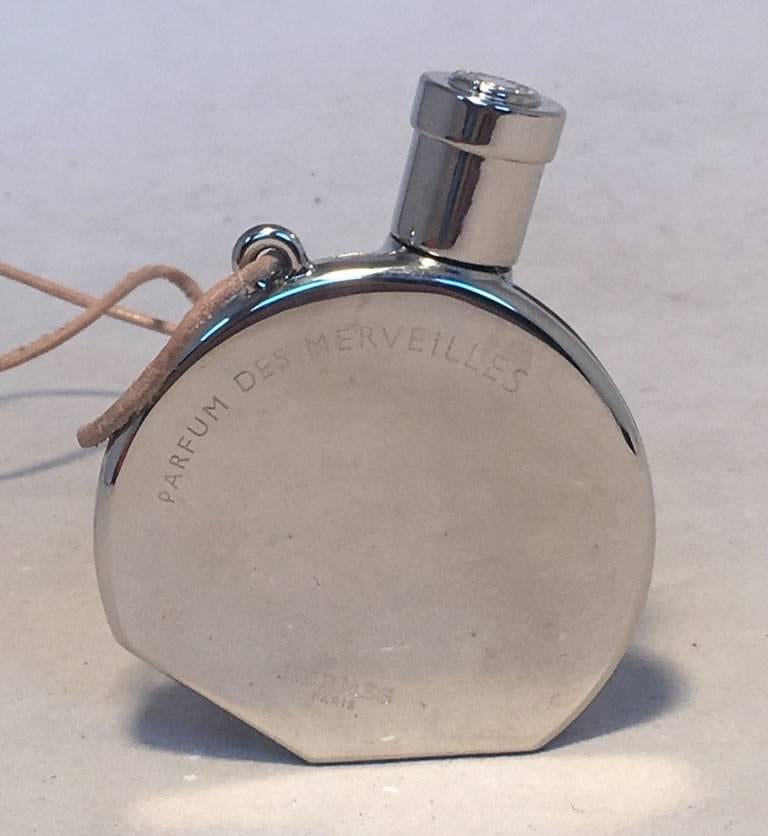 Hermes Perfume Bottle Silver Necklace with perfume des merveilles In Excellent Condition In Philadelphia, PA