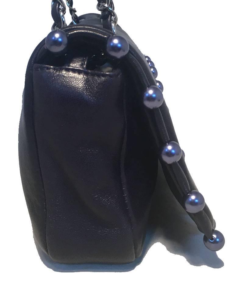 GORGEOUS Chanel navy blue leather pearl trim classic flap shoulder bag in excellent condition.  Navy blue leather body with matching blue pearls around the edges and CC front logo.  Woven chain and leather shoulder strap.  Single flap snap closure
