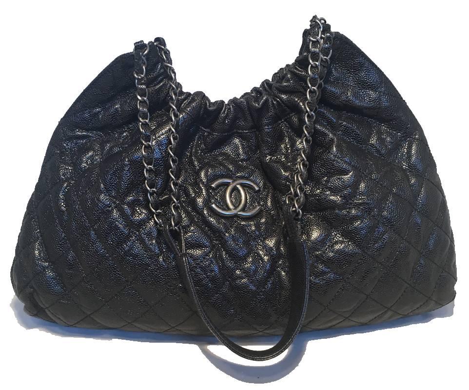 BEAUTIFUL Chanel quilted caviar shoulder bag tote in excellent condition.  Black quilted caviar exterior trimmed with antiqued silver hardware.  Woven chain and leather shoulder straps with solid leather shoulder.  Elastic gathered top closure with
