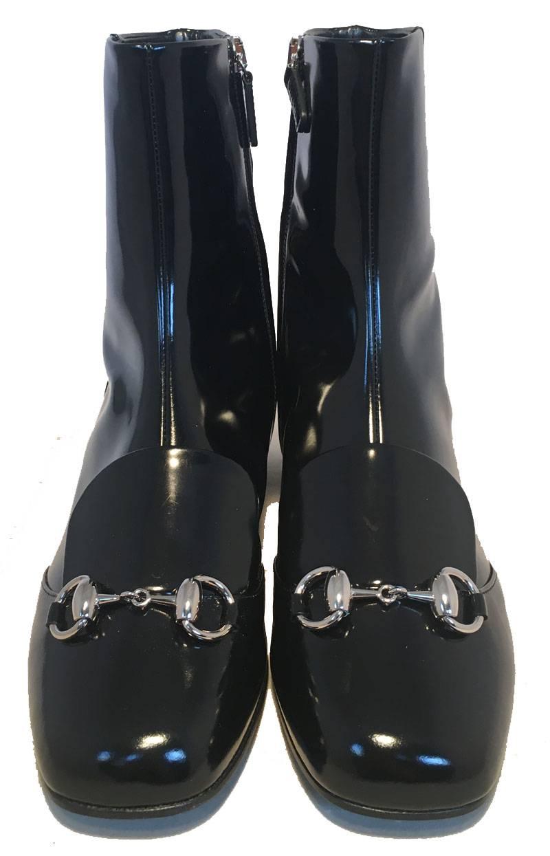 AMAZING Gucci Black patent leather regent ankle boots in nwot excellent condition.  Black patent leather trimmed with silver hardware.  Signature Gucci harness D ring detail along top foot of both shoes.  Side ankle zipper closures.  Black leather