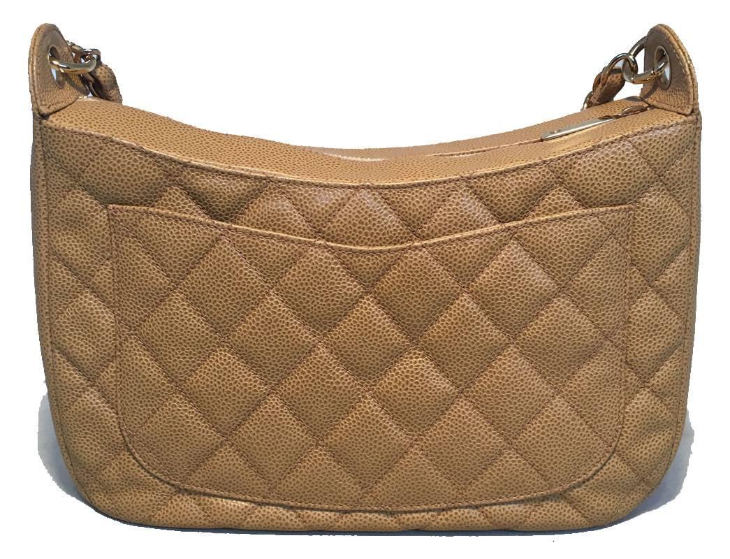 STUNNING Chanel tan caviar leather shoulder bag in excellent condition.  Tan quilted caviar leather exterior trimmed with gold hardware, signature woven chain and leather shoulder strap and CC logo quilted along the front side.  Top zipper closure