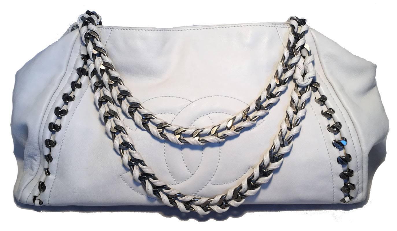 FABULOUS CHANEL white leather chain trim shoulder bag tote in excellent condition.  White leather exterior with quilted CC chanel logo along front side and silver braided chain and leather shoulder straps.  top snap closure opens to a white leather
