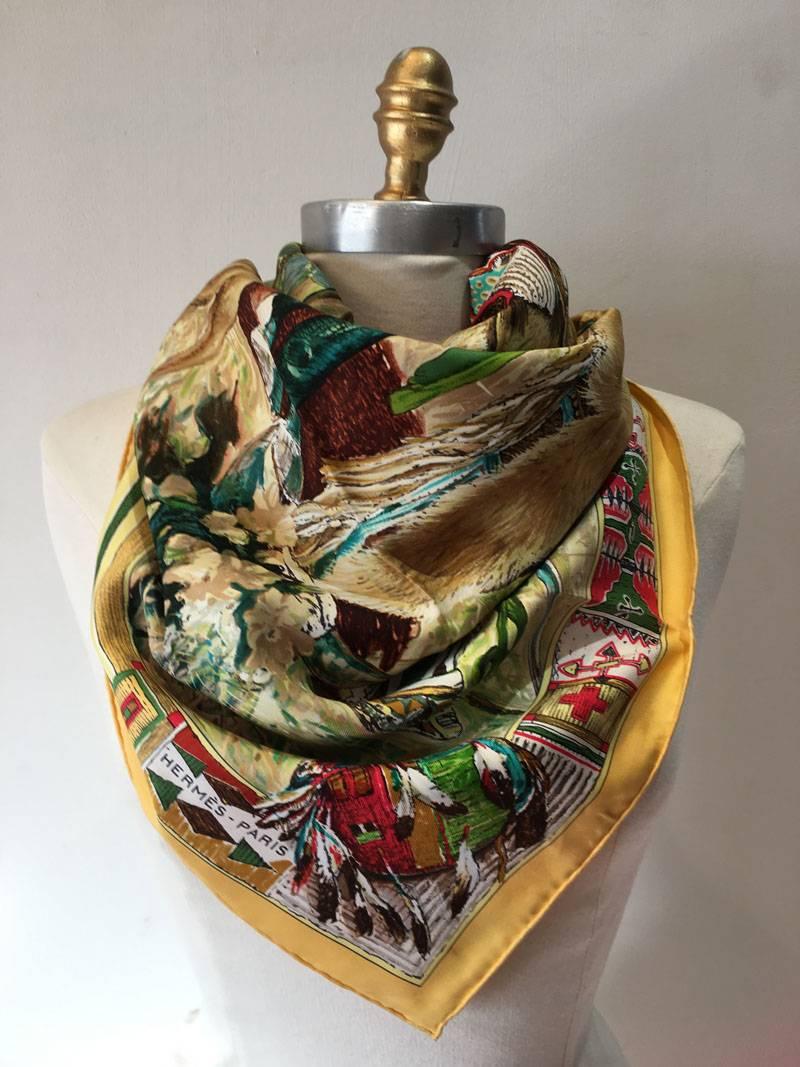 AMAZING Hermes vintage les cheyennes silk scarf in very good vintage condition.  Original silk screen design c1993 by Kermit Oliver depicts a classic native american setting complete with horses, head dresses, and native printed border designs
