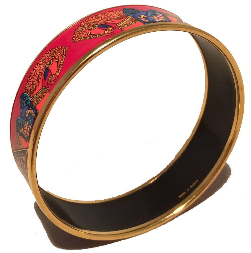 FABULOUS Hermes red and blue horse print enamel bangle bracelet in excellent condition.  Red background with red and blue dressed horse head print and geometric stacked design all trimmed with gold hardware.  Made in Austria.  Box included.  No