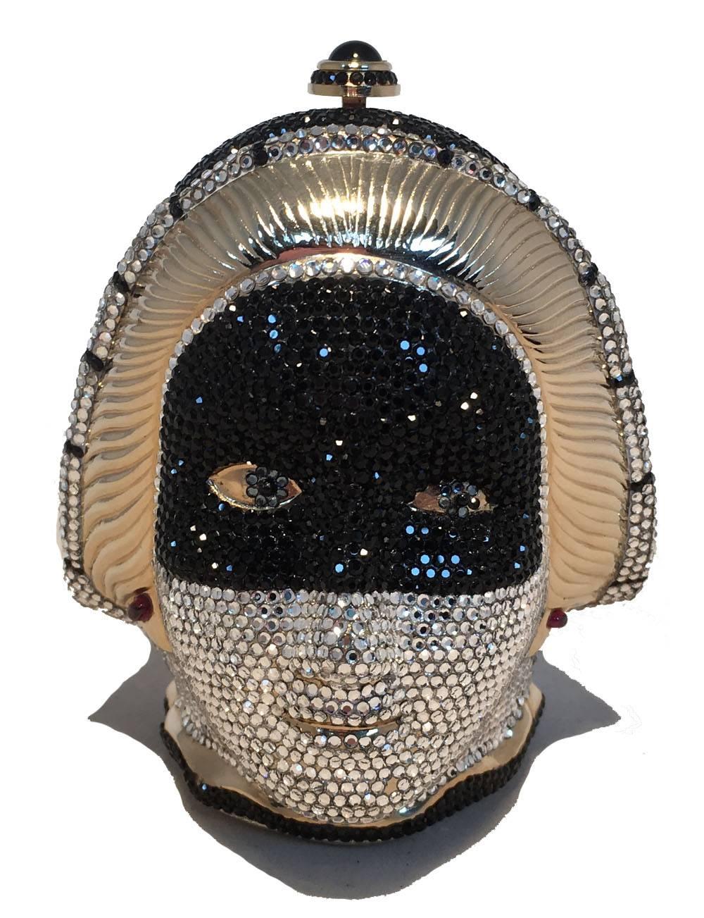 STUNNING Judith Leiber Queen head Swarovski crystal minaudiere in excellent condition.  Unique Queen of hearts head design with black and white swarovski crystals throughout.  Top button closure opens to a gold leather lined interior that holds 2