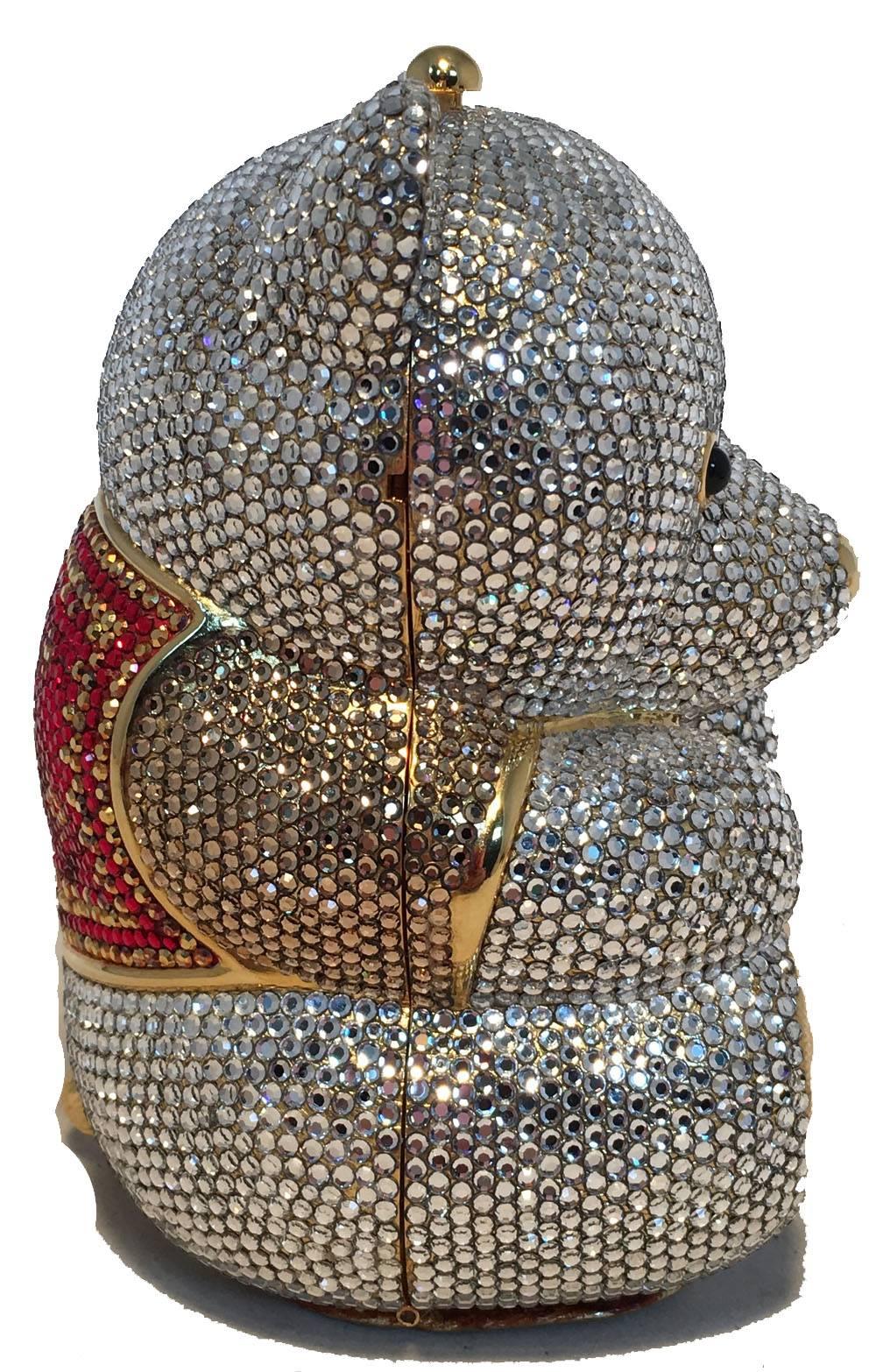 ADORABLE Judith Leiber teddy bear minaudiere in excellent condition. Clear swarovski crystal exterior with red crystals on vest, Black semi precious stone eyes and gold form body throughout. Gold leather base. Top button closure opens to a gold
