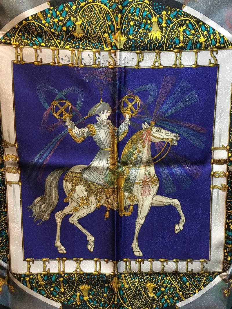 GORGEOUS Vintage Hermes Feux D'artifice silk scarf in excellent condition.  Original silk screen design c1987 by Michel Duchene features a centered horse design with renaissance style rider centered in a square and circle thats surrounded by cosmic