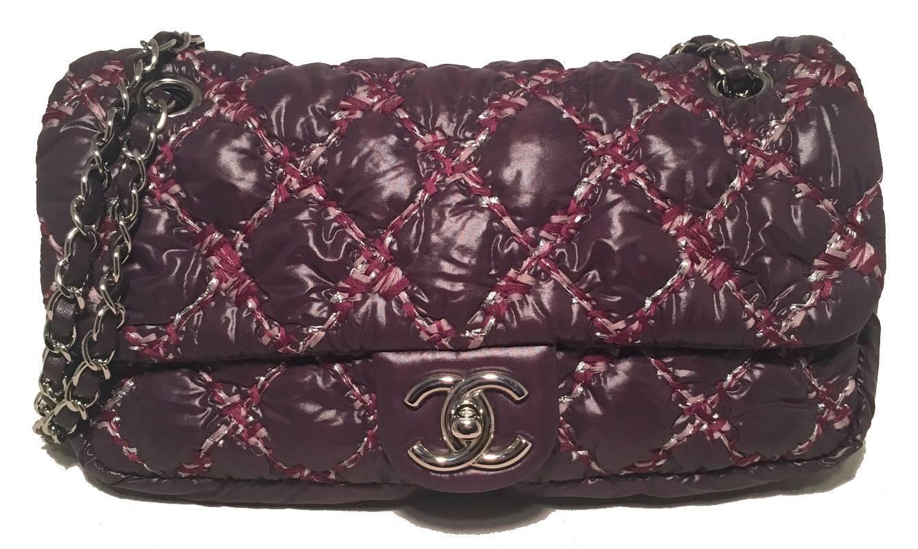 RARE Chanel Plum Nylon Quilted Puffy Classic Flap Shoulder Bag in excellent condition.  Dark plum purple nylon exterior quilted with a unique thick threaded pink and maroon topstitching all trimmed with silver hardware.  Front CC logo twist closure