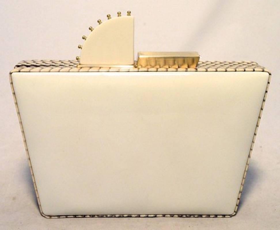 LIMITED EDITION TANYA HAWKES gold and cream painted box clutch in excellent condition. Hand painted exterior featuring beautiful metallic gold stripes trimmed with creamy white acrylic stone and bronze hardware embellishments along the side and top