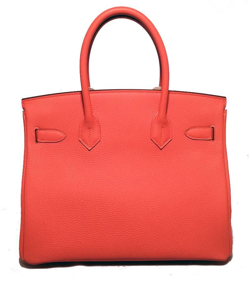 NEW- Hermes 30cm Feu togo leather birkin bag in like-new condition.  Limited Edition Feu togo leather exterior trimmed with gold hardware and signature matching gold lock and keys in clochette.  Front twist double strap closure opens to a matching