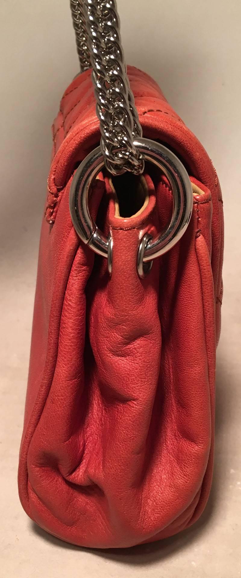 BEAUTIFUL Chanel Orange Leather Chain Trim Classic Flap Shoulder Bag in excellent condition.  Dark orange leather exterior trimmed with silver hardware and snake chain shoulder strap.  chain trim along bottom exterior edges.  Front snap single flap