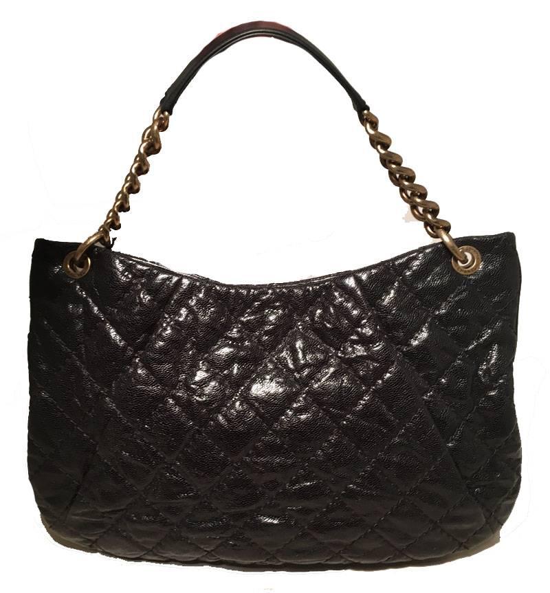 TIMELESS Chanel Black Quilted Caviar Leather Shoulder Bag in excellent condition.  Quilted black caviar leather exterior trimmed with bronze hardware and double shoulder straps.  Attached chain and leather shoulder strap sits comfortably under the