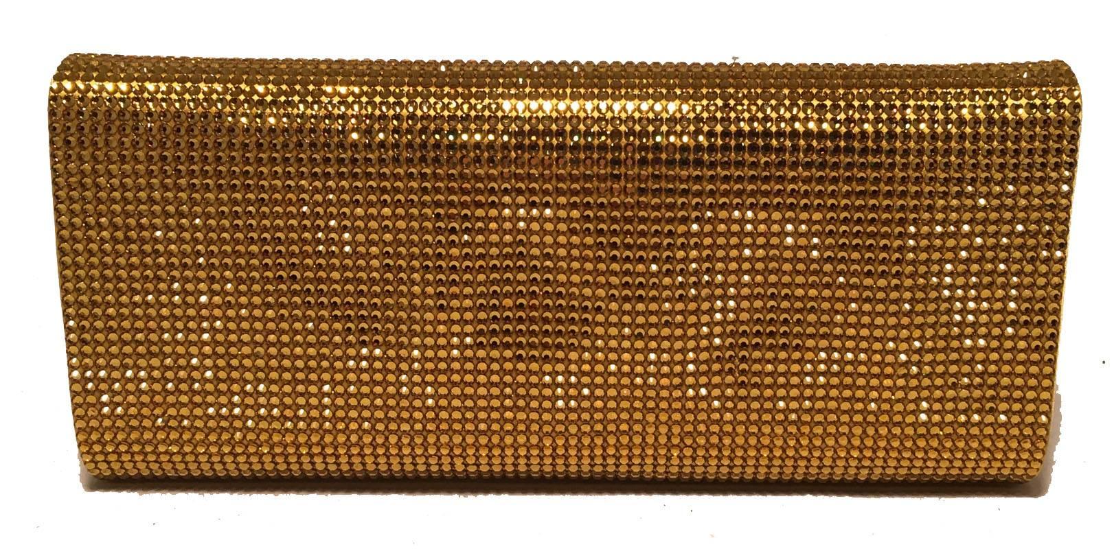 GORGEOUS Judith Leiber Gold Crystal Evening Bag Clutch in excellent condition.  Gold crystal exterior in classic envelope rectangle shape.  Front flap snap closure opens to yellow gold and purple silk lined interior that holds a silver chain handle