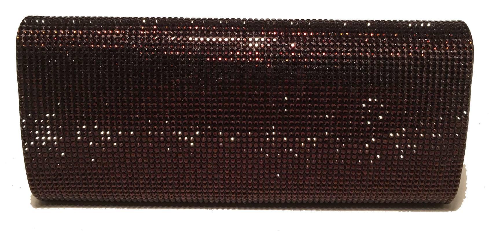 GORGEOUS Judith Leiber Dark red Crystal Evening Bag Clutch in excellent condition.  Dark red crystal exterior in classic envelope rectangle shape.  Front flap snap closure opens to dark red and purple silk lined interior that holds a silver chain