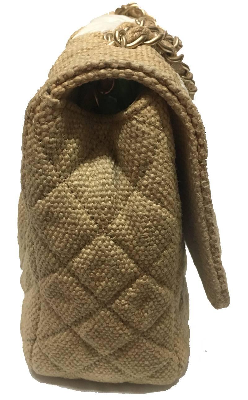 Gorgeous Chanel Tan Quilted Soft Raffia Woven Jumbo Classic Flap Bag in excellent condition.  Tan quilted soft woven raffia with white raffia design along top flap.  matte gold hardware.  CC twist logo double flap closure opens to a tan silk lined