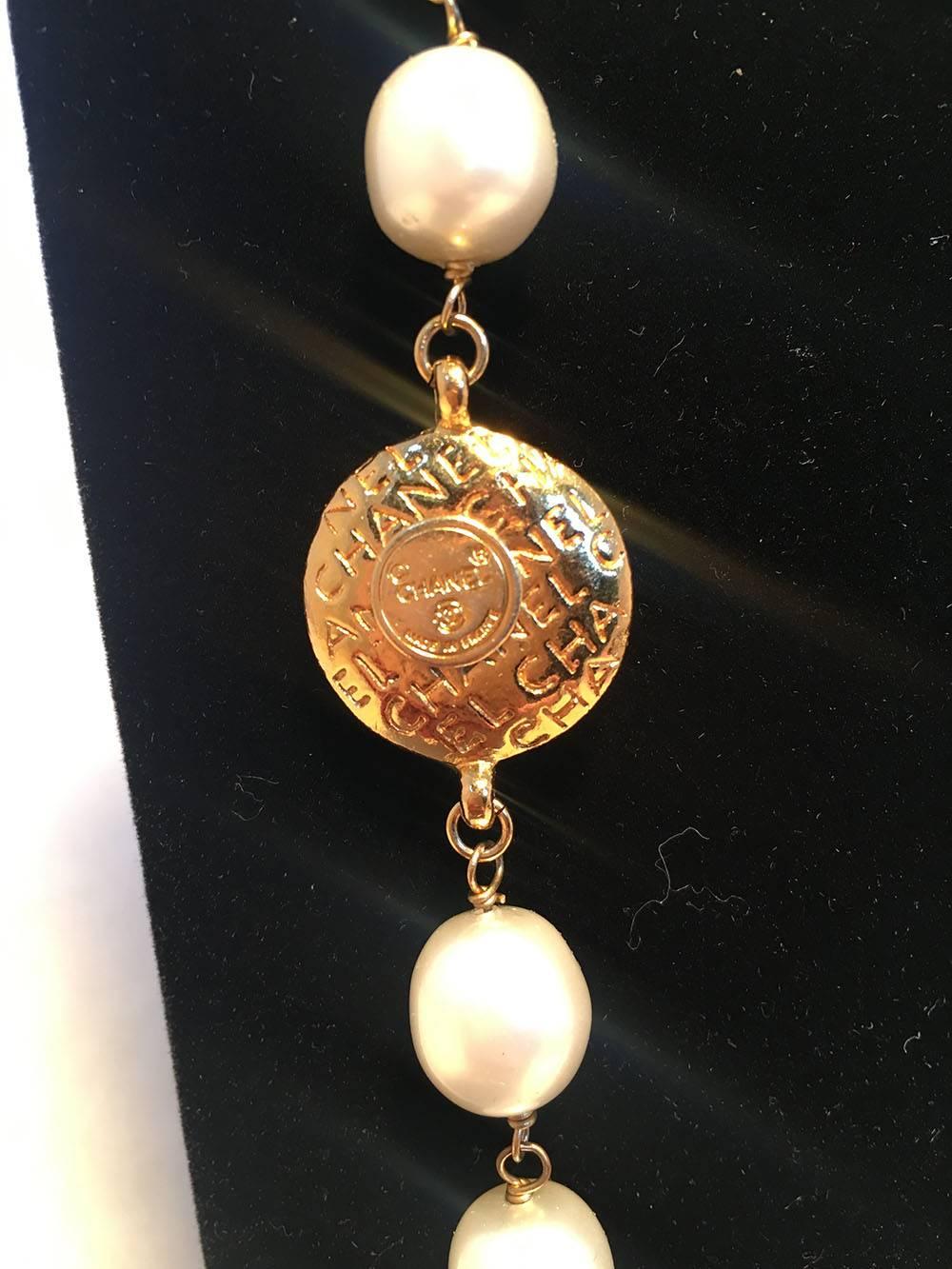 BEAUTIFUL Chanel pearl and gold coin necklace in excellent vintage condition. Delicate pearls strung together with gold plated coins throughout. Each coin features either the iconic profile of Coco Chanel wearing a hat or the Chanel name engraved in