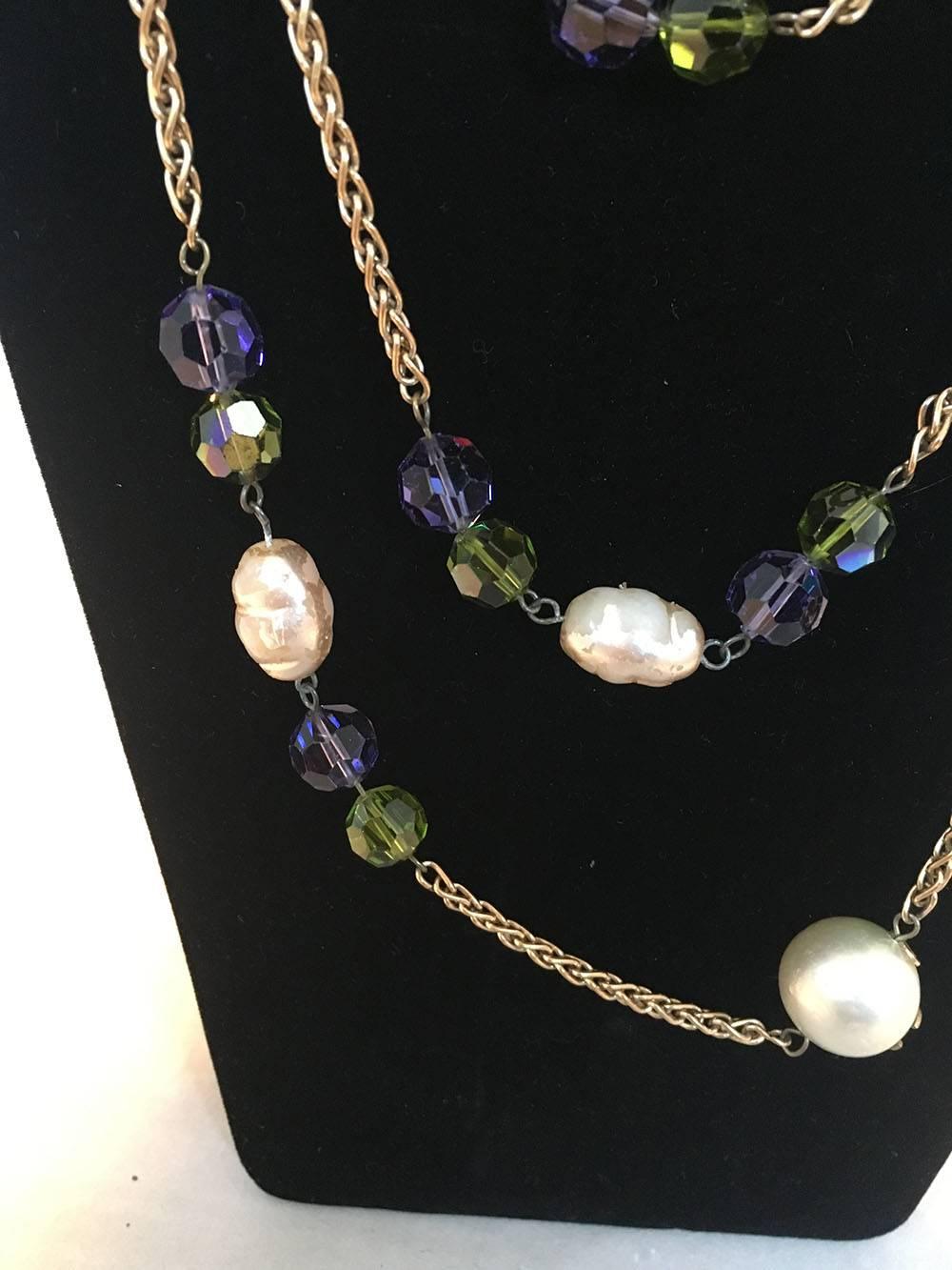 STUNNING Chanel Vintage Gold Necklace with Large Pearls & Green and Purple Crystal Beads in good condition. Gold link chain necklace with large round pearl beads that feature matte gold CC logos and purple and green crystal cut beads. Wear