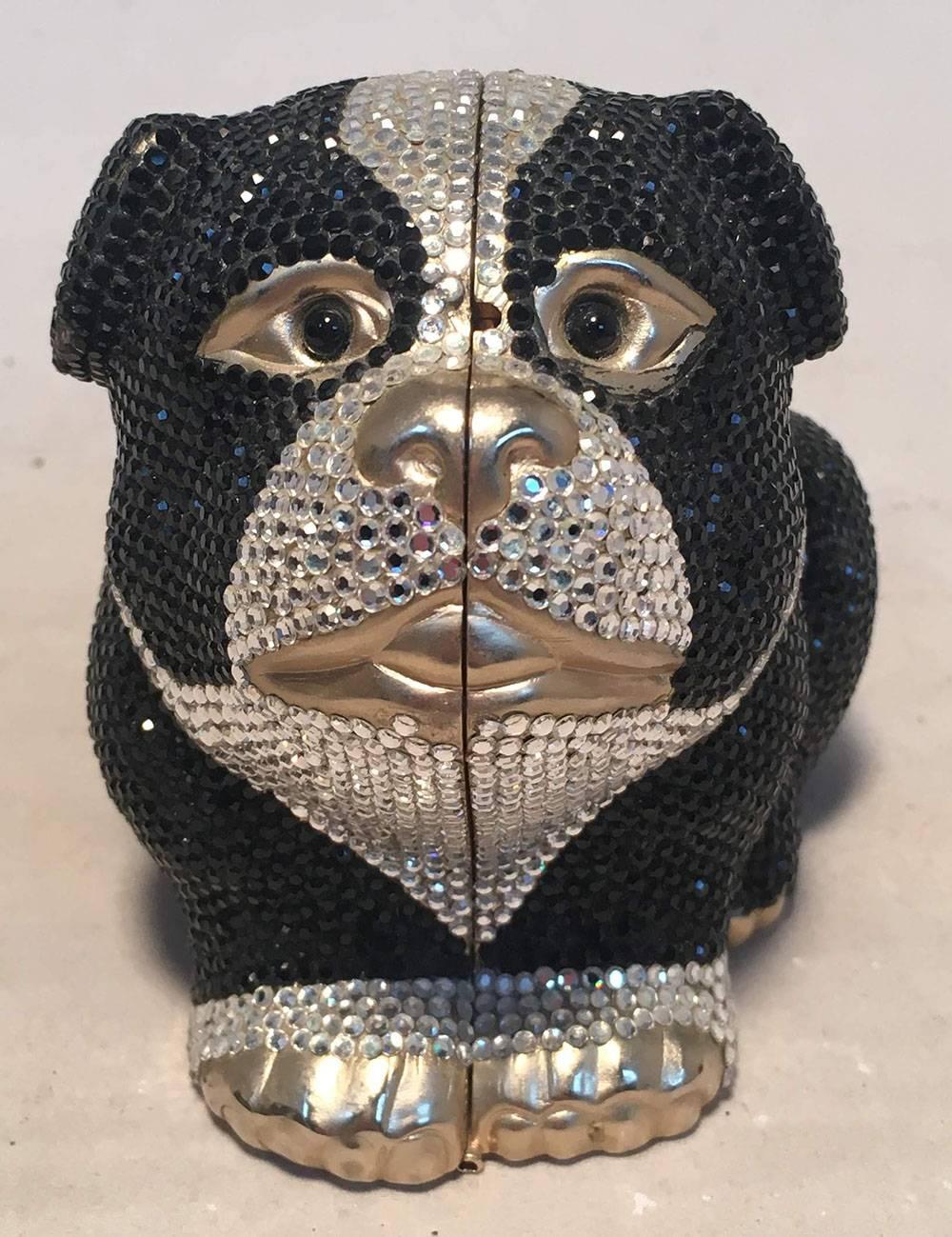 BEAUTIFUL Judith Leiber Swarovski Crystal bulldog minaudiere evening bag in excellent condition.  Black and silver Swarovski crystal exterior with gold bulldog shaped body. Top button closure opens to a gold leather lined interior with 2 separate
