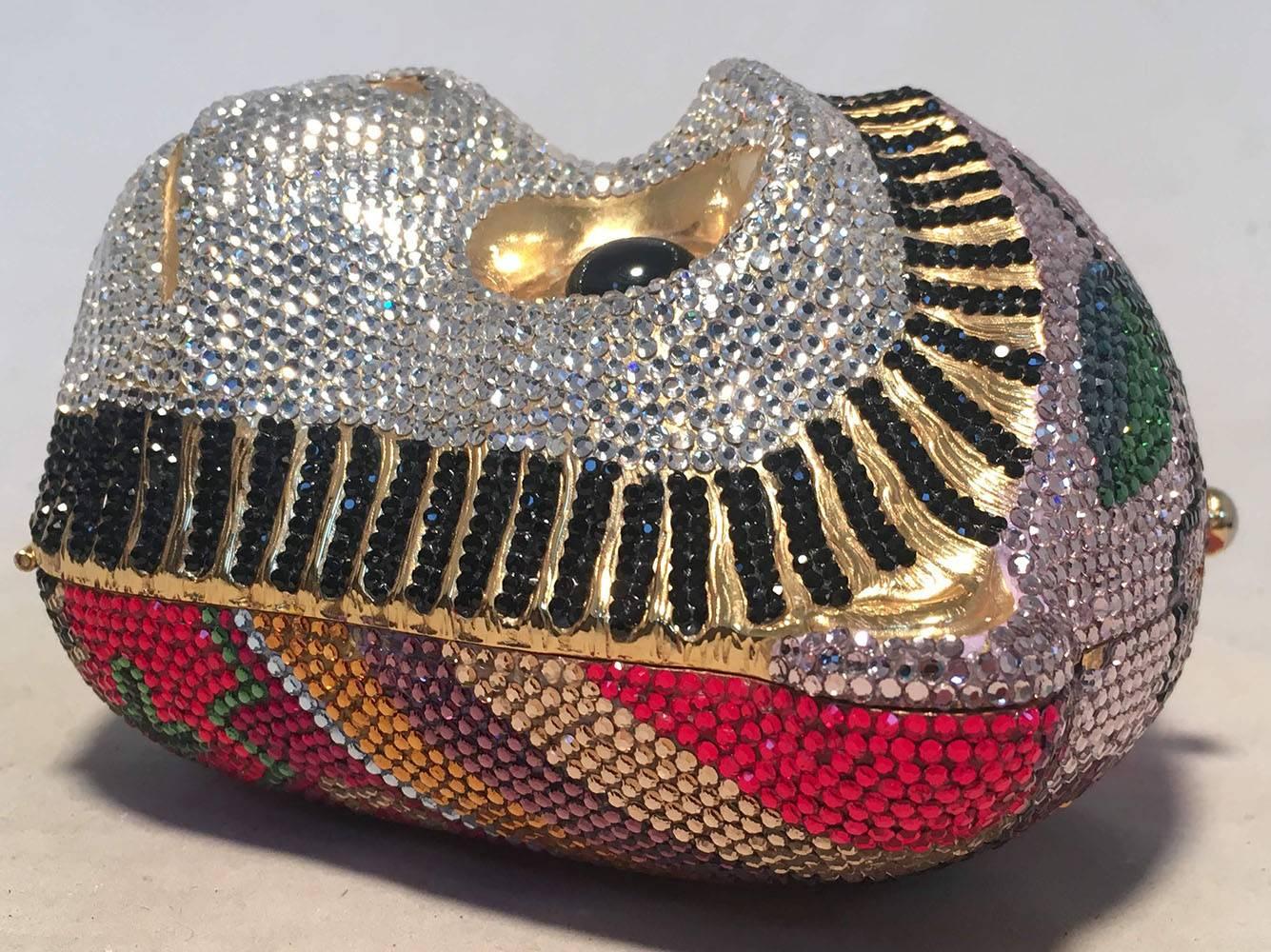 RARE Judith Leiber Swarovski Crystal Monkey Head Minaudiere Evening Bag in excellent condition.  Multicolor swarovski crystal exterior trimmed with black round glass beaded eyes and black and clear crystal face with striped outline detail. Top