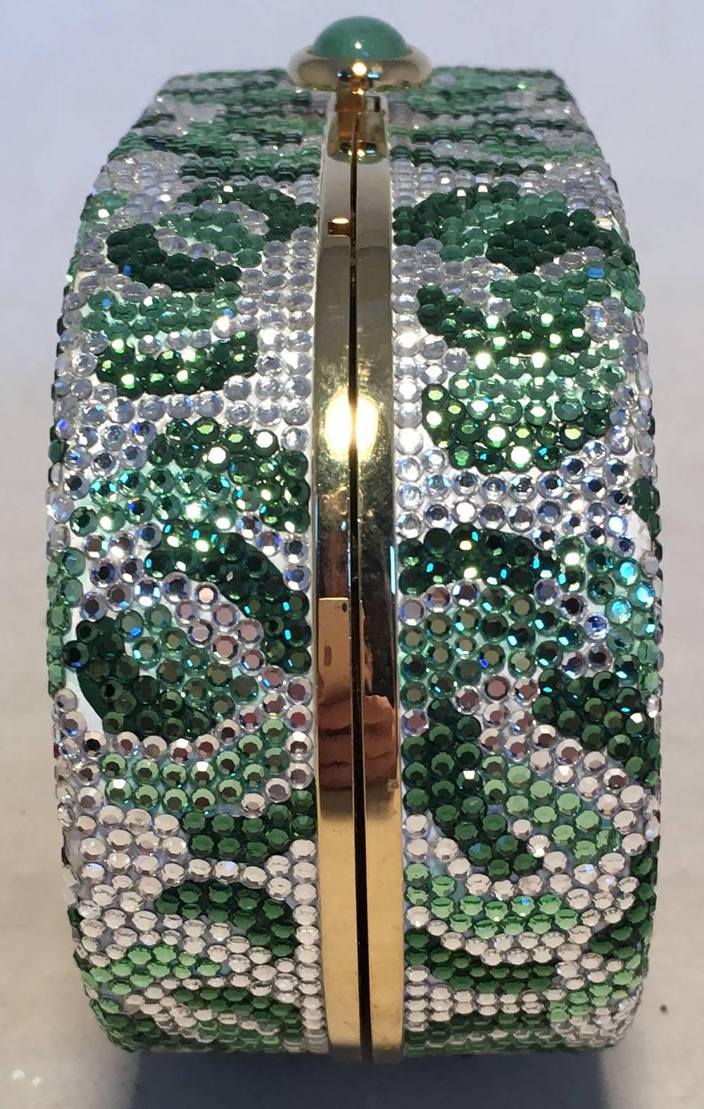 BEAUTIFUL Judith Leiber Vintage Swarovski Crystal Floral Print Oval Minaudiere Evening Bag in excellent condition. Multicolor swarovski crystal exterior in a unique floral print pattern. Top Jade button closure opens to a gold leather interior with