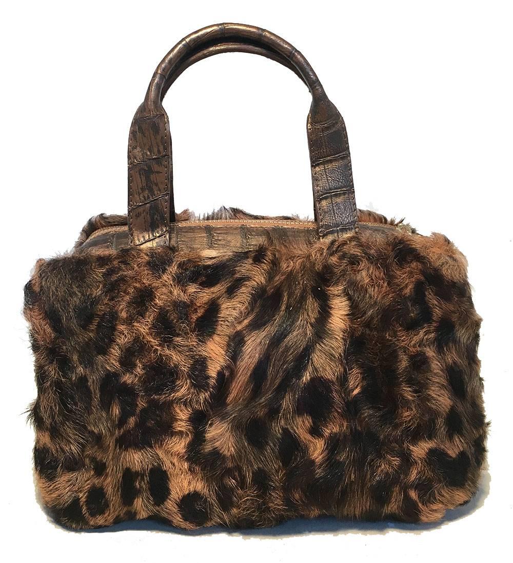 FABULOUS Nancy Gonzalez Leopard Print Fur and Crocodile Baguette in excellent condition.  Brown leopard print fur body with bronze crocodile leather trim. Double top handles for easy carrying. 3 top zipper closures reveal 2 side exterior pockets and