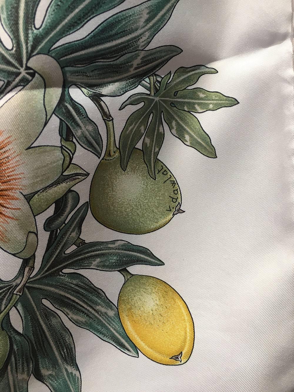 GORGEOUS Hermes Passiflores Silk Scarf c1996 in Cream in excellent condition.  Original silk screen design c1996 by Valerie Dawlat-Dumoulin features a centered star design in tan surrounded by green foliage with lemon and lime fruits, a basket with