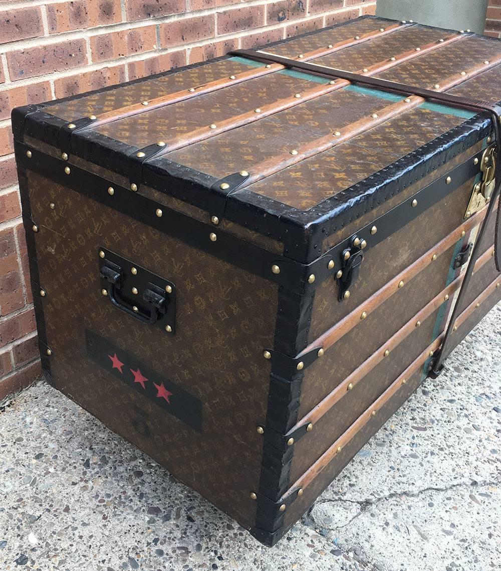 AMAZING Louis Vuitton antique steamer trunk in excellent condition. Original production c1920's. Signature monogram canvas exterior trimmed with brass hardware, wood and lozine trim, and a green, dark red, and white ID stripe surrounding. Triple