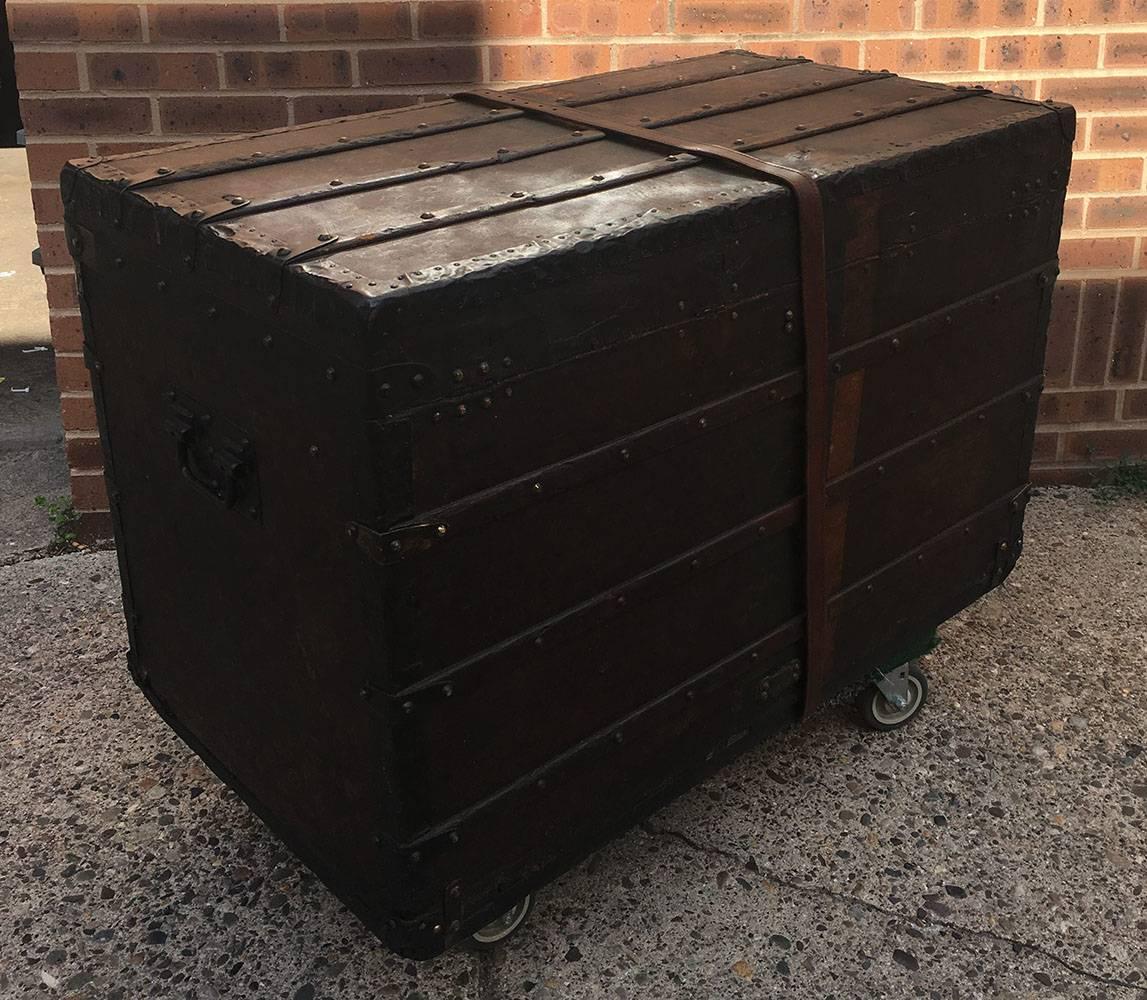 STUNNING Louis Vuitton antique monogram steamer trunk in excellent antique condition. Original signature monogram canvas exterior trimmed with wood and brass hardware. Orange and green stripe surround the outside and were originally painted to help