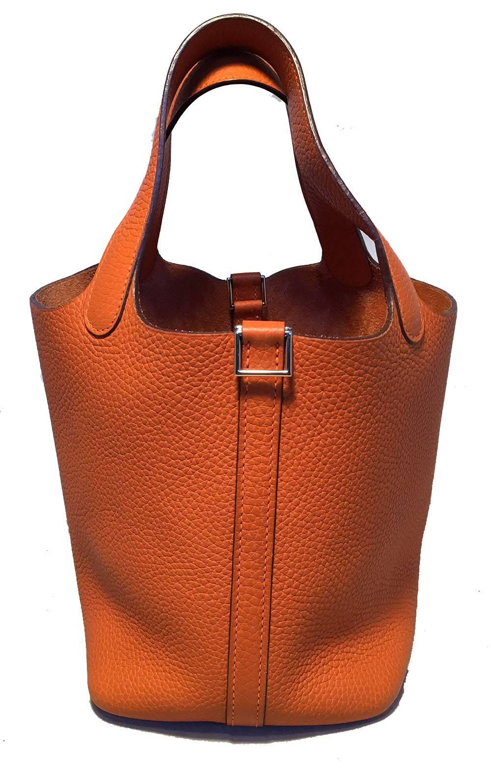 Fabulous Hermes Orange Clemence Leather Picotin PM Handbag in excellent condition.  Orange clemence leather exterior trimmed with silver palladium hardware. Perfect small size for any occasion and fits all your essentials in classic Hermes style.