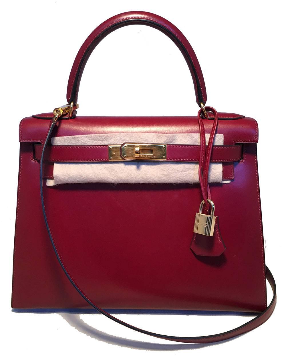 STUNNING Hermes Vintage Rouge Box Calf 28cm Kelly Bag with Strap in excellent condition.  Rouge red box calf leather trimmed with gold hardware. Removable matching shoulder strap included. Top signature kelly style double strap twist closure opens