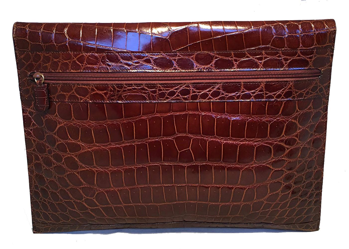 GORGEOUS Colombo Vintage Tan Crocodile Portfolio Clutch in excellent condition. Tan crocodile exterior trimmed with a gold hardware closure. Exterior back zippered pocket. Pinch lock flap closure opens to 2 separated interior compartments. Back