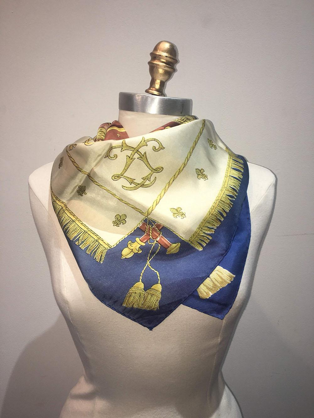 BEAUTIFUL Hermes Vintage Vue De Carrosse de la Galere la Reale Silk Scarf c1950s in fair condition. Centered illustration of an antique wooden ship adorned with gold trims and embellishments and blue deck coverings with coachmen on either side.