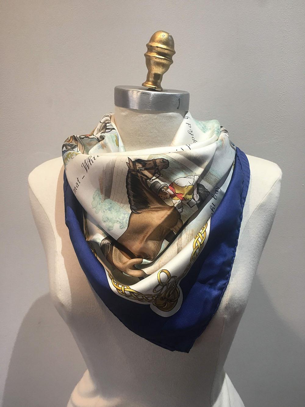CLASSIC Hermes vintage les robes silk scarf in very good condition. Original silk screen design by Philippe Ledoux c1968 features 9 illustrations of various show horse dressings over an ivory background and surrounded by a navy blue border. 100%