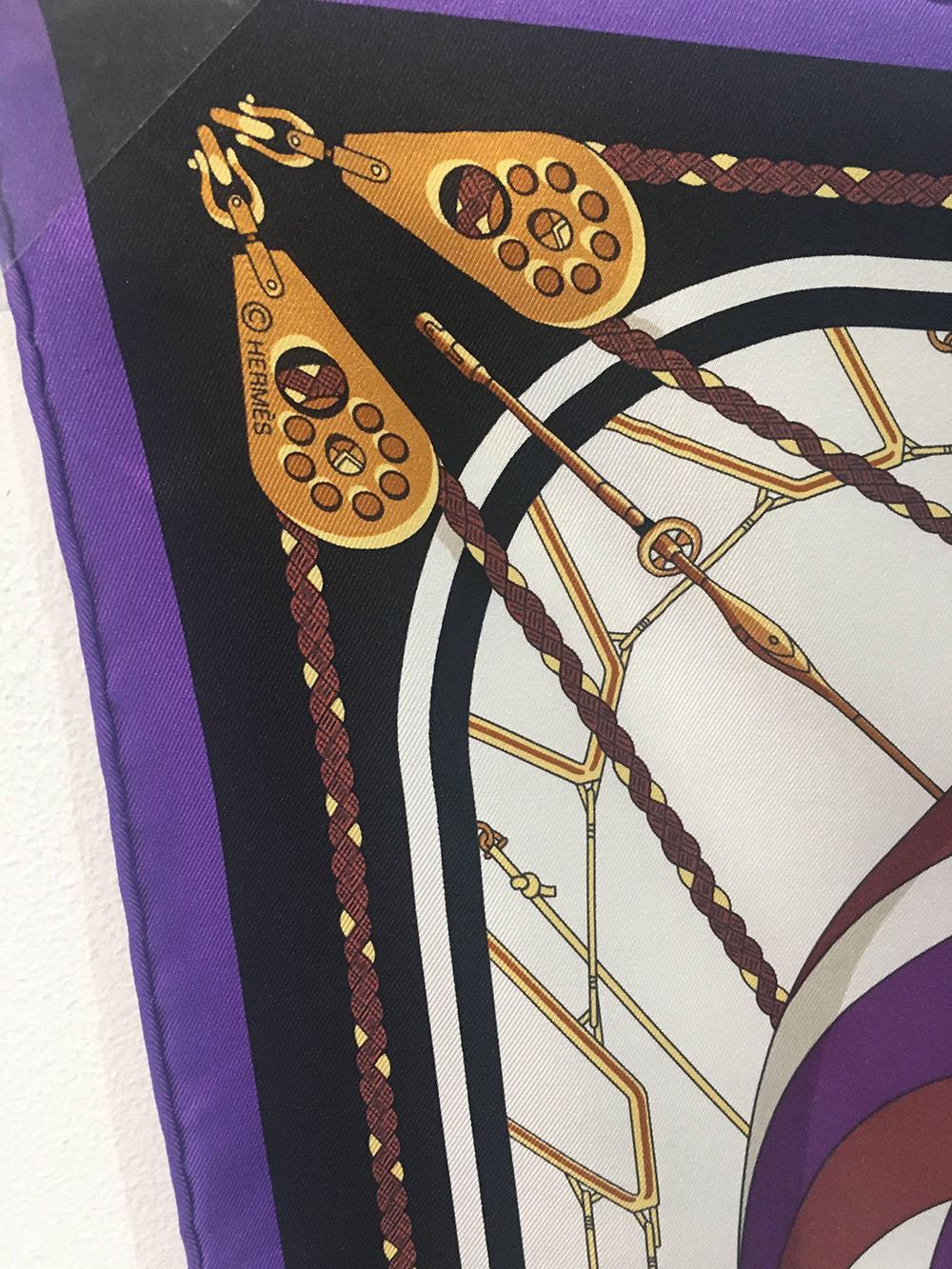 AMAZING Hermes Vintage Spinnaker Silk Scarf in excellent condition. Original silk screen design c1982 by Julia Abadie features a nautical theme with centered racing sailboats on the water surrounded by various spinnaker sails in purple and golds all
