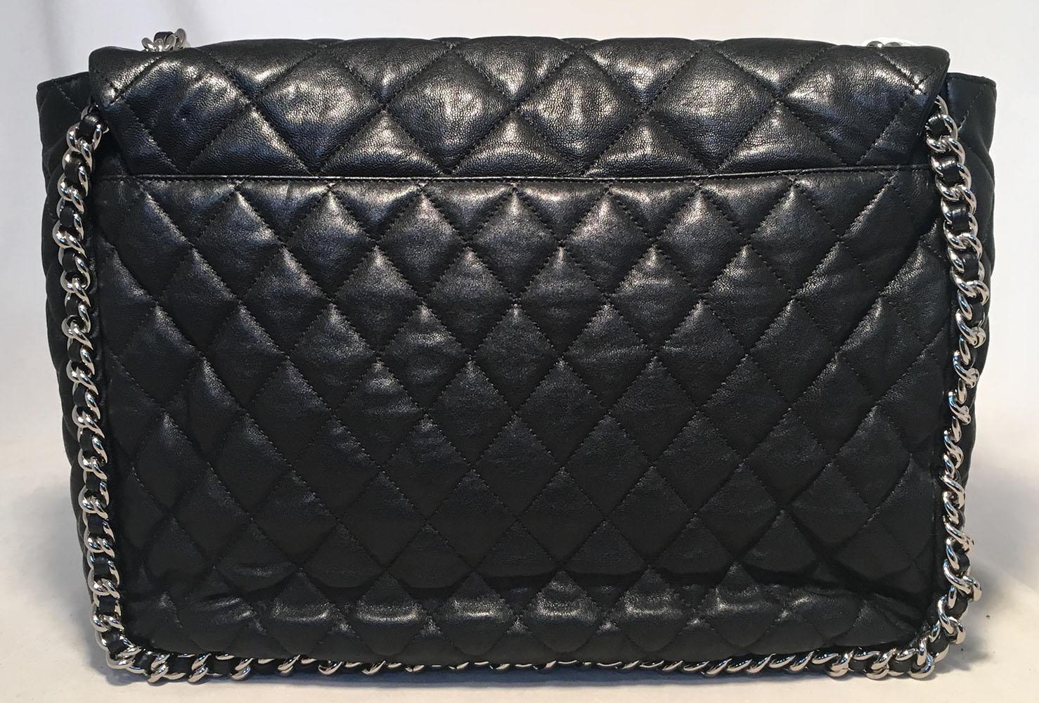 Chanel Black Quilted Leather Chain Trim Classic Maxi Flap Shoulder Bag in excellent condition.  Quilted black leather exterior trimmed with silver hardware and magnetic front CC snap closure. Single flap closure opens to a light gray nylon interior