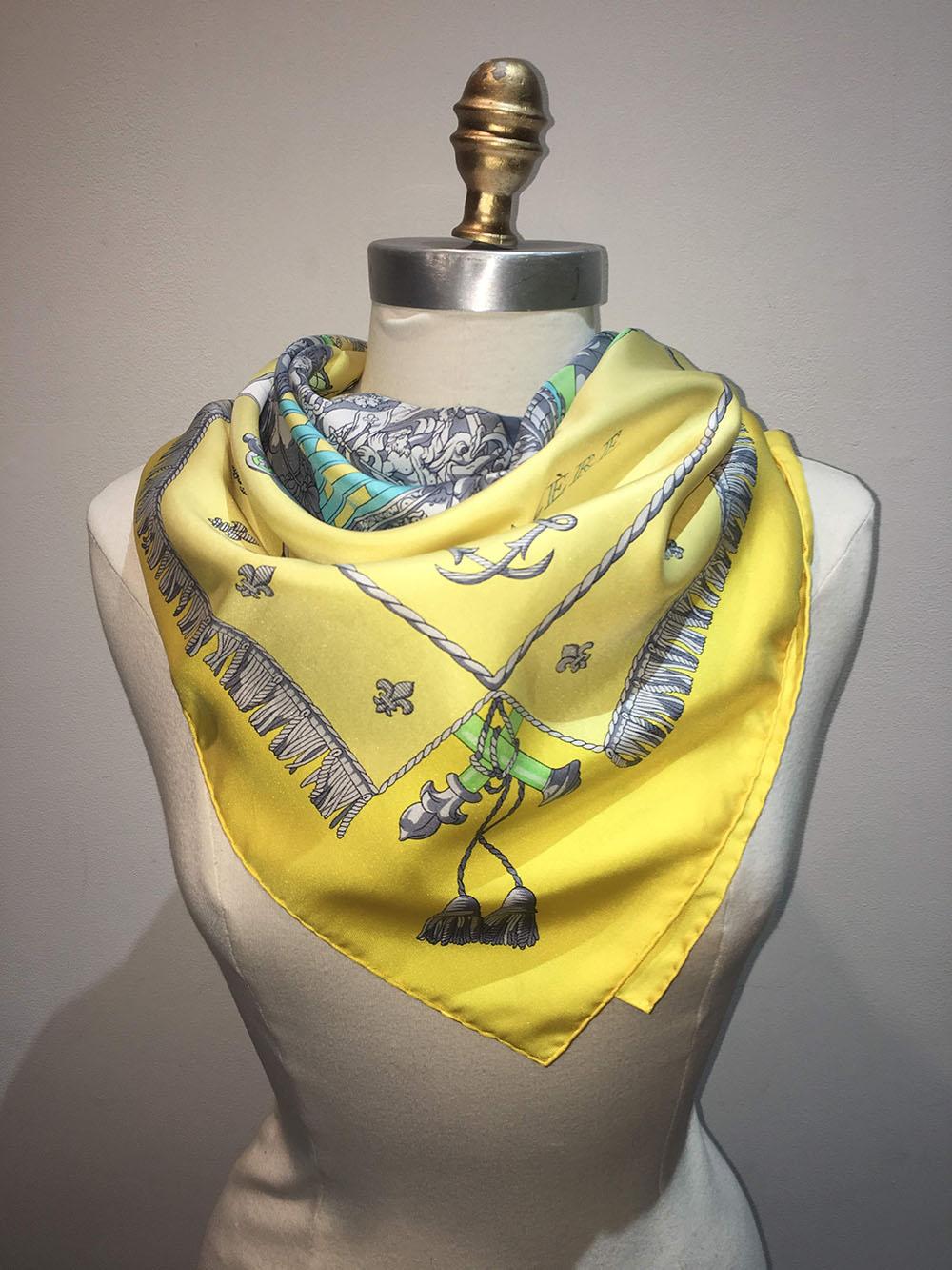 FABULOUS Hermes Yellow Vue De Carrosse de la Galere la Reale Silk Scarf in excellent condition. Centered illustration of an antique ship in blue, green and grey adorned with grey trims and embellishments and yellow deck coverings with coachmen on