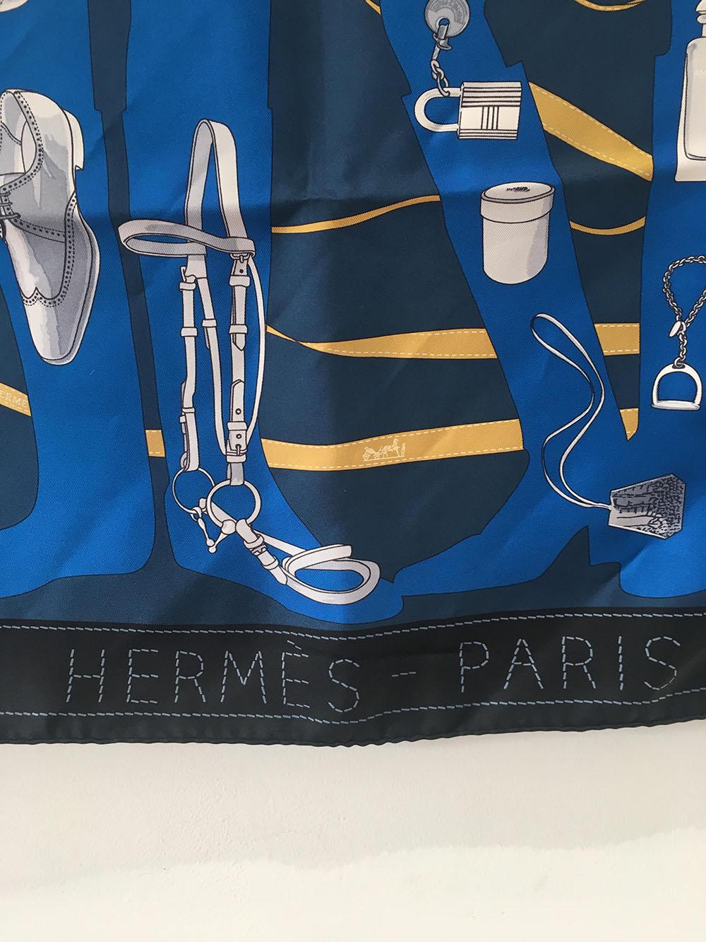 Beautiful Hermes Monsieur et Madame Silk scarf in Navy in excellent condition. Original silk screen design c2006 by Bali Barret features a centered blue outline of a man and woman standing together filled with the various Hermes accessories that