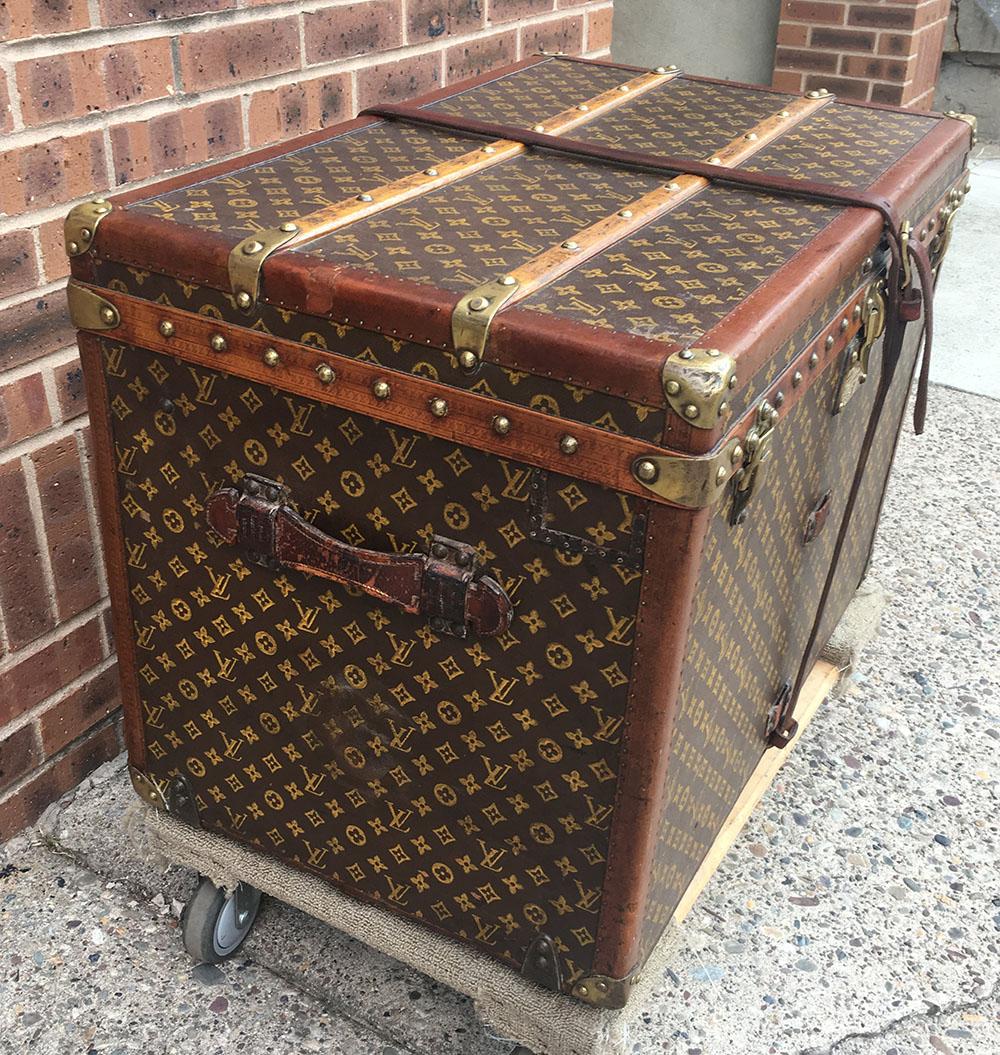 AMAZING Louis Vuitton Antique Monogram Small Steamer Trunk with Basket Tray c1920s in excellent preowned condition.  Signature Louis Vuitton monogram canvas exterior trimmed with wood and brass hardware. Front triple latch closure opens to a beige