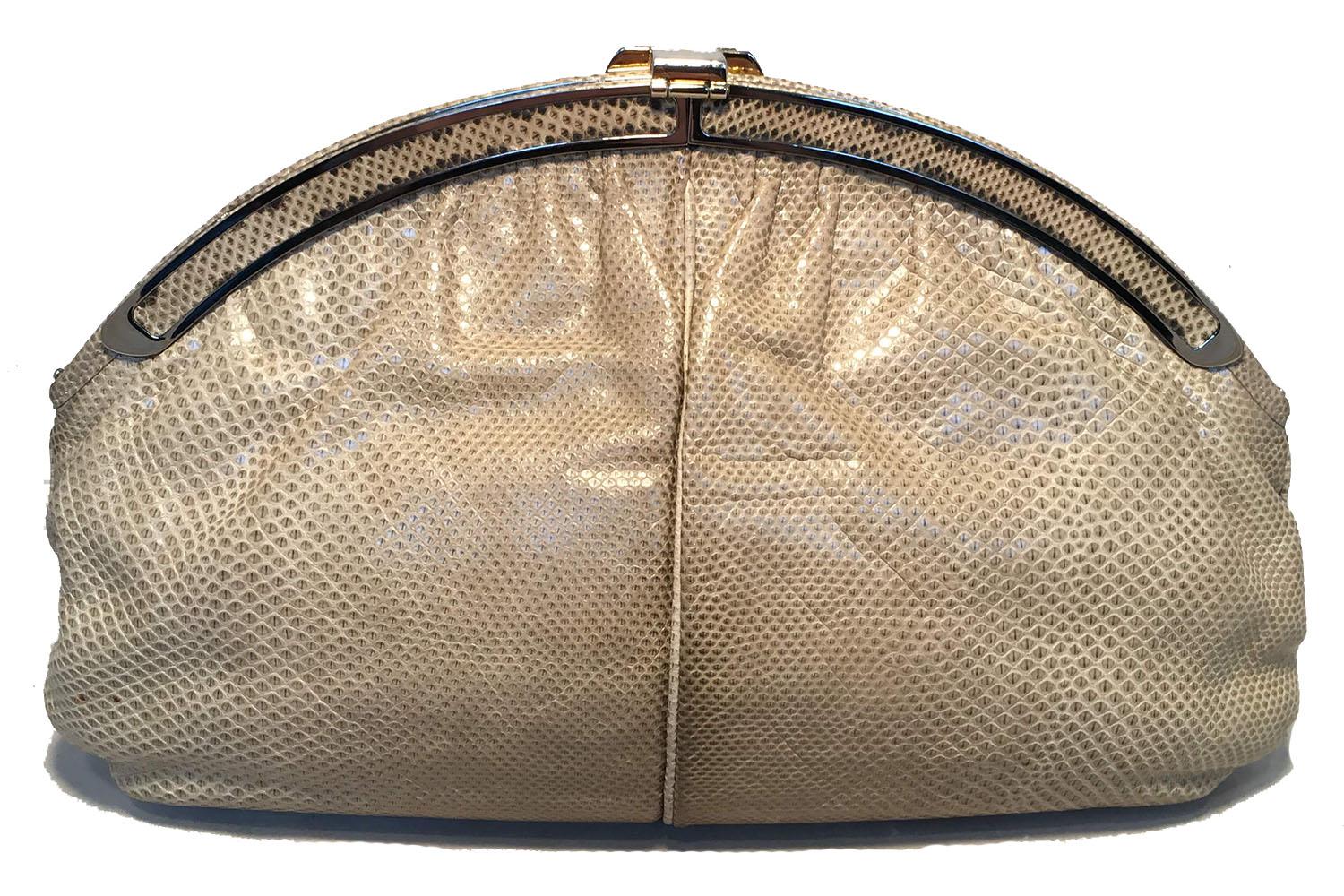 AMAZING Judith Leiber Vintage Beige Lizard Oversized Clutch in excellent condition. Natural beige lizard leather exterior trimmed with silver and gold hardware. Lift latch hinge closure opens to a light beige leather interior that holds one side