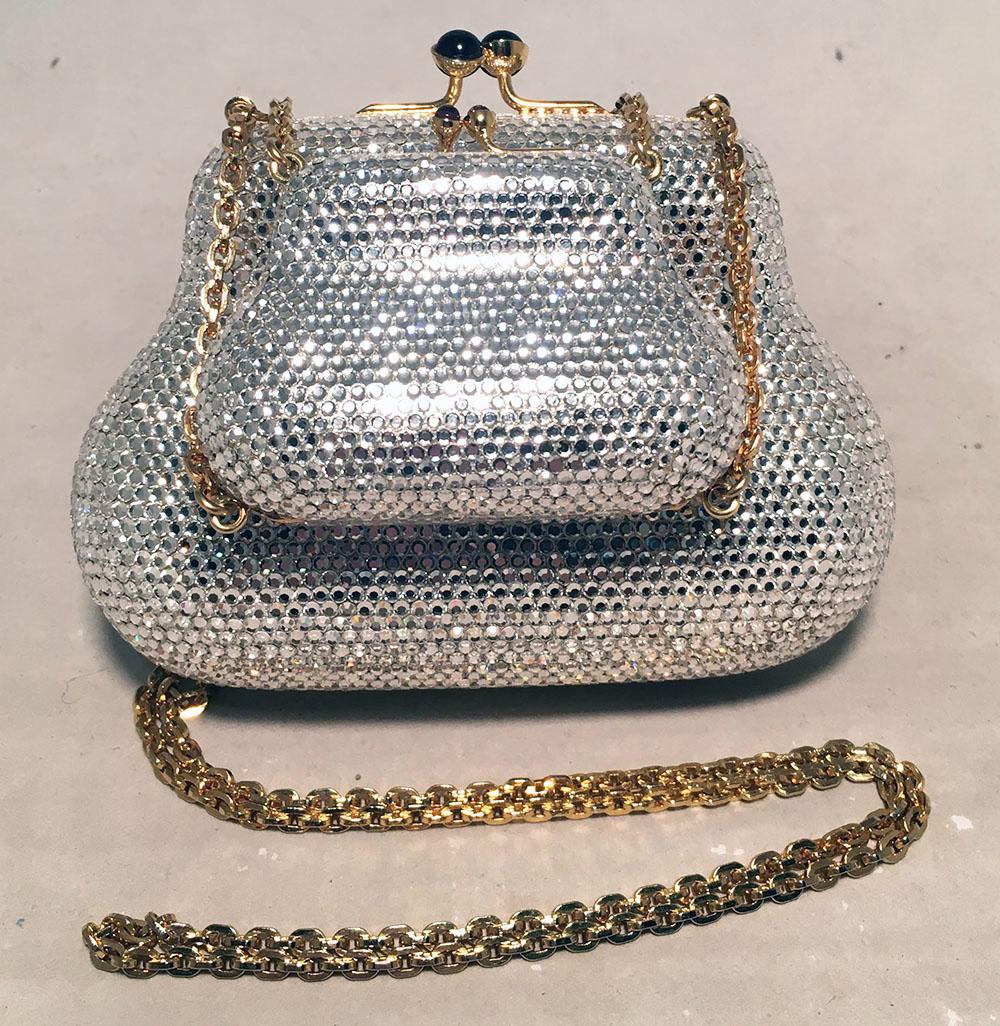 RARE Judith Leiber Double Clear Crystal Minaudiere Evening Shoulder Bag in excellent condition. 2 clear swarovski crystal covered minaudieres attached by a gold chain shoulder strap. Both have a top kiss lock closure and open to a gold leather lined