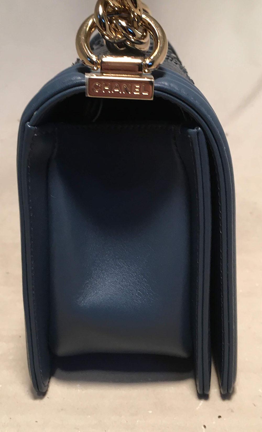 STUNNING Chanel Marine Blue Snakeskin Le Boy Classic Flap Shoulder Bag in like-new condition. Dark marine blue leather and snakeskin exterior trimmed with gold hardware. Pinch latch single flap closure opens to a matching marine blue leather