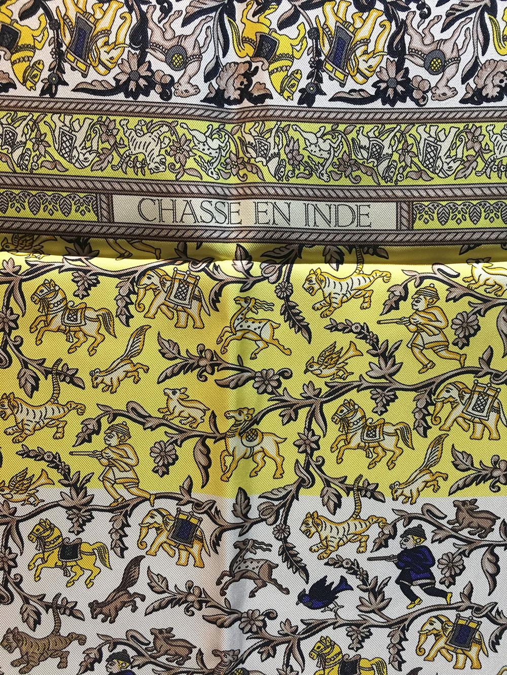 FABULOUS Hermes Vintage Chasse en Inde Silk Scarf in Yellow in excellent condition. Original silk screen design c1986 by Michel Duchene features an intricate design depicting hunting in India over a yellow and white background and border. 100% silk,