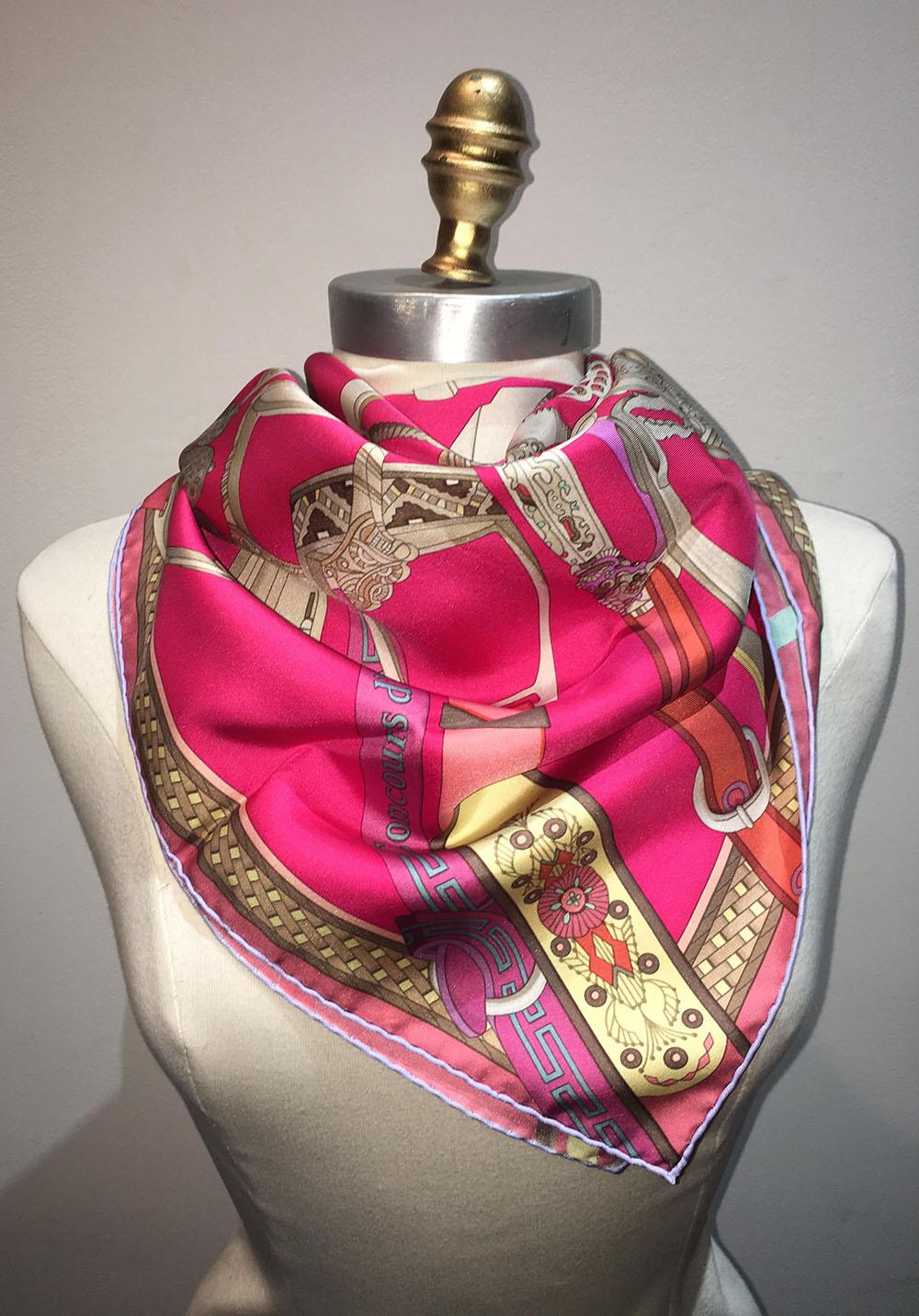GORGEOUS RARE Hermes Concours d'Etriers Silk Scarf in Pink in excellent condition. Original silk screen design by Virginie Jamin c2011 features various horse footings and shoes in greys and pewters with multi colored leather strap holders over a