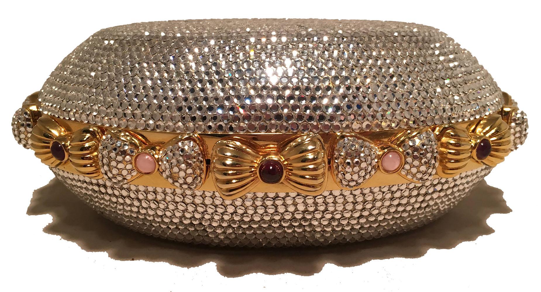 BEAUTIFUL Judith Leiber Swarovski Crystal Oval Bow Trim Minaudiere Evening Bag Clutch in excellent condition. Clear Swarovski crystal exterior in an oval shape surrounded by crystal bows around the outside. Each bow features a delicate small colored