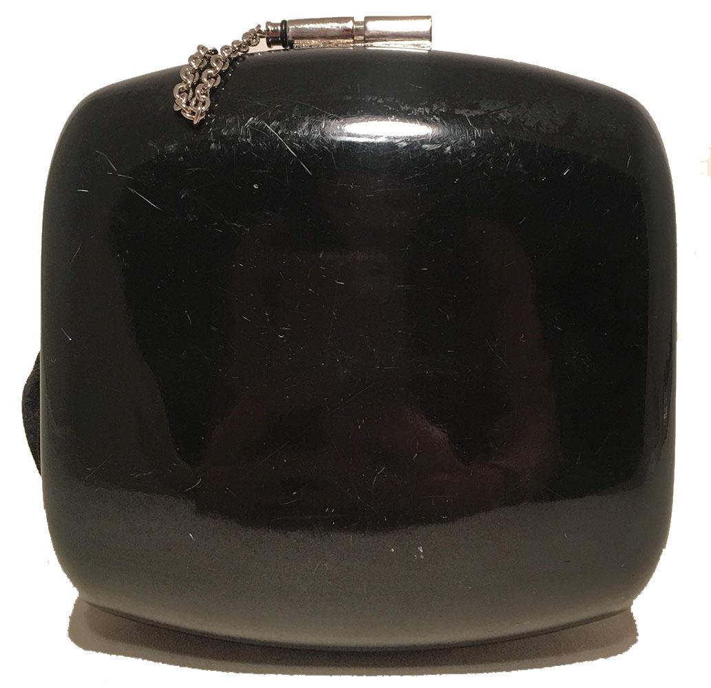 STUNNING Limited Edition Runway Chanel Black Box Crystal Adorned Wristlet Clutch in very good condition. Black curved box shape trimmed with silver hardware and various sized clear crystals along the front side. Top pin lock closure opens to a black